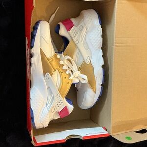 Nike Kids Gold and White Sneakers with Pink Accents